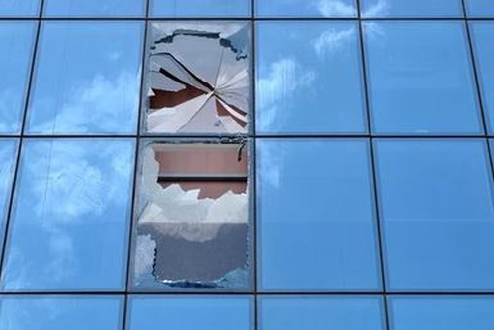 Broken commercial glass before repair